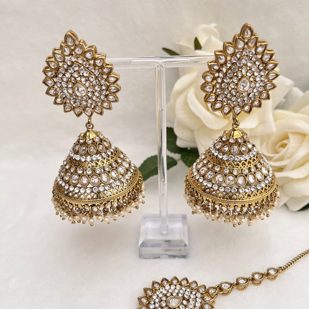 Indian Jewellery with heavy earrings and tikka, Gold in colour with Polki stones