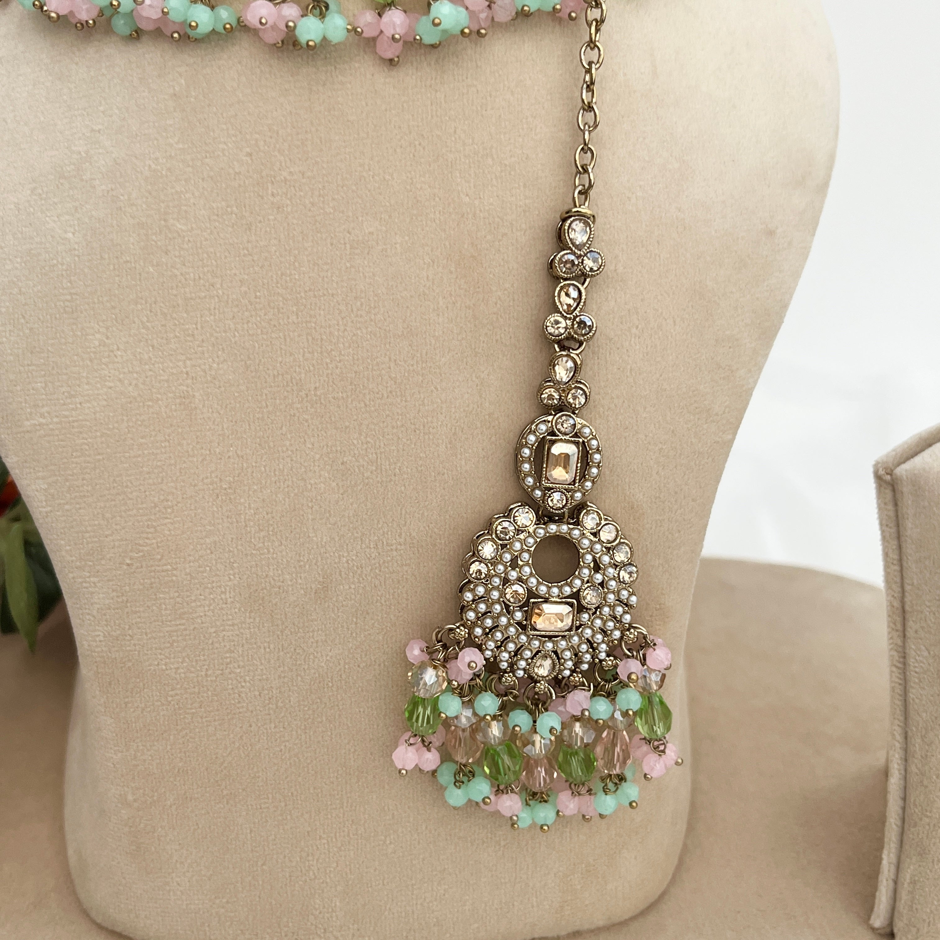 Pastel coloured crystal stones and Polki stones,necklace with tikka and earrings.