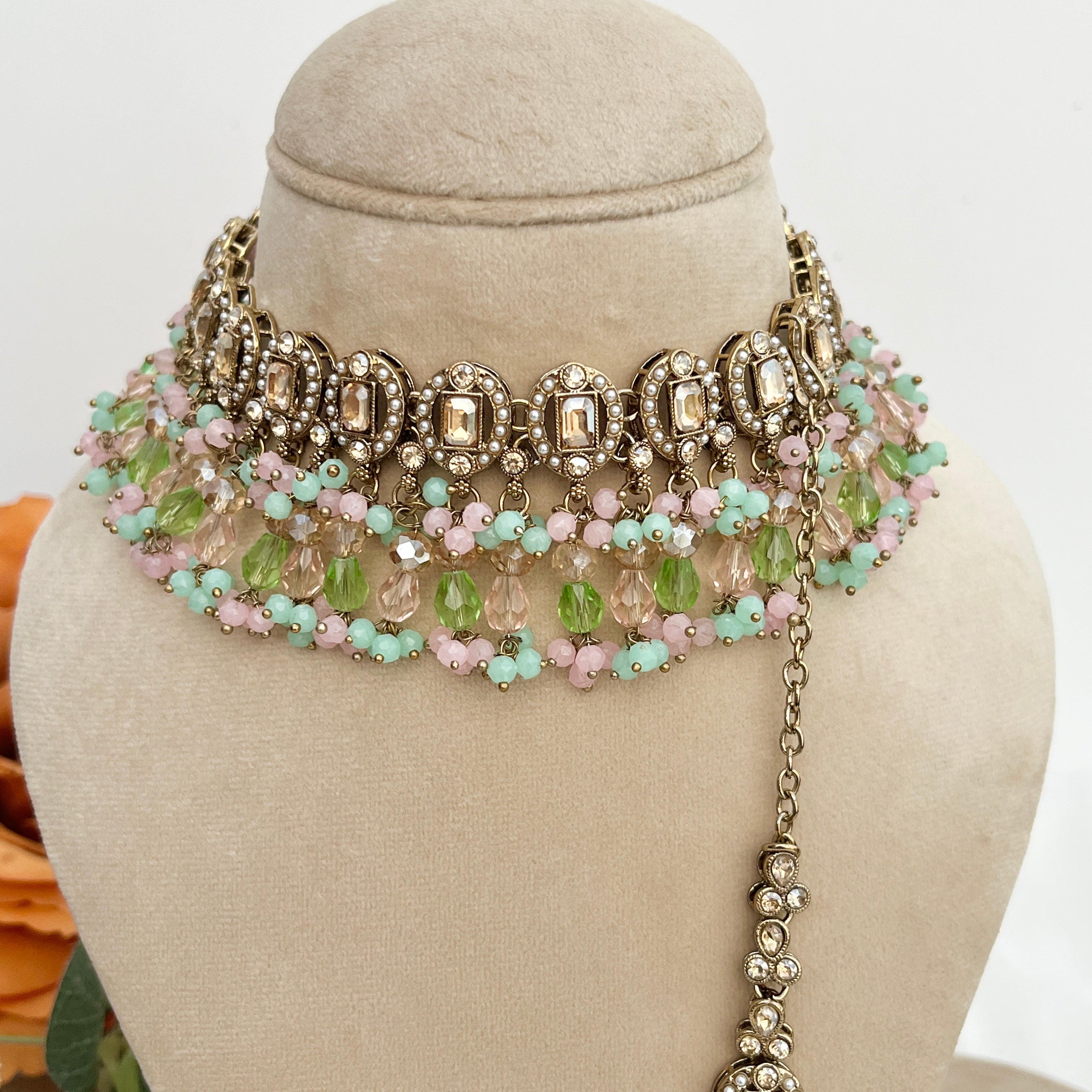 Pastel coloured crystal stones and Polki stones,necklace with tikka and earrings.