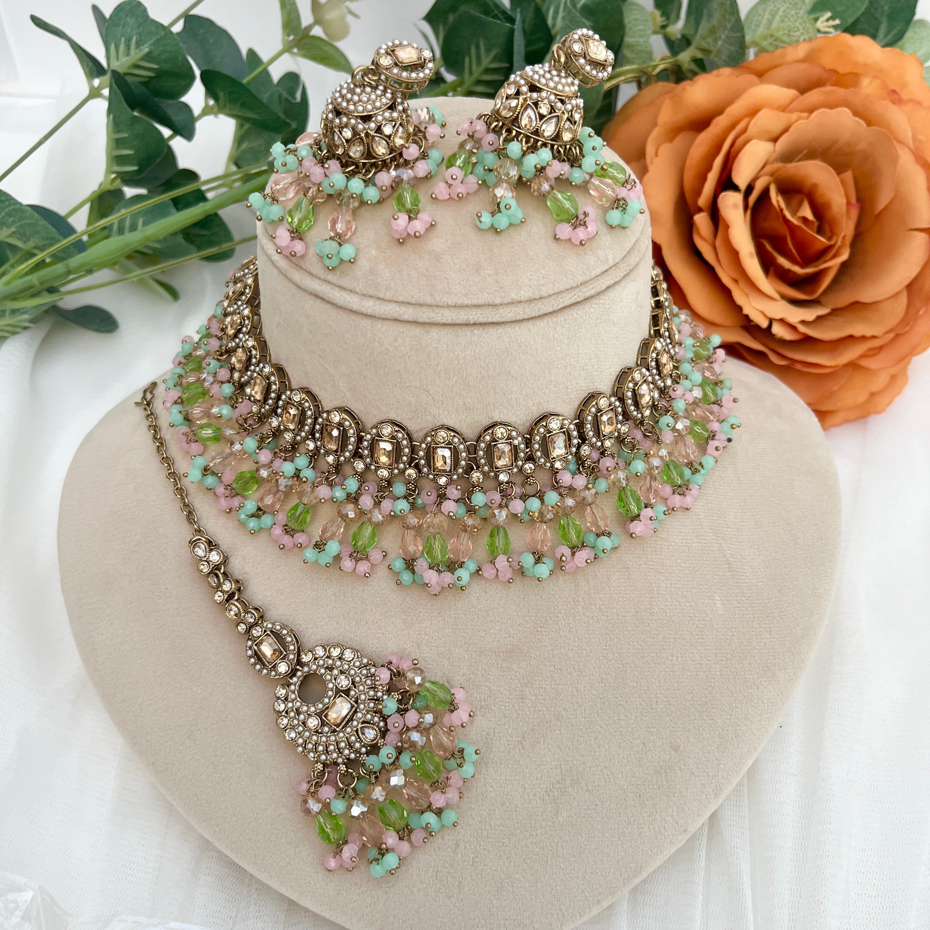 Pastel coloured crystal stones and Polki stones,necklace with tikka and earrings.