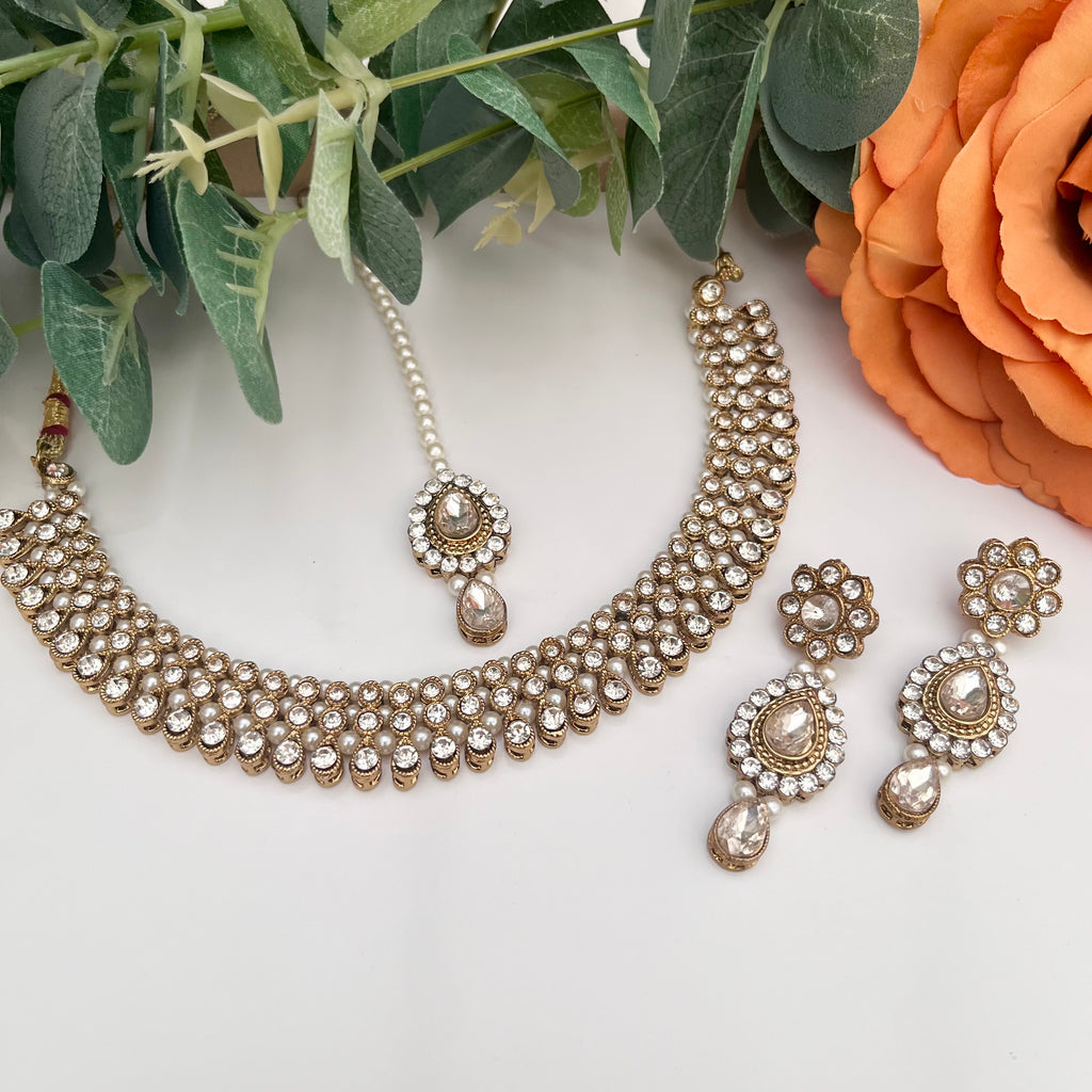 Reverse AD Gold and Transparent Stone coloured Jewellery