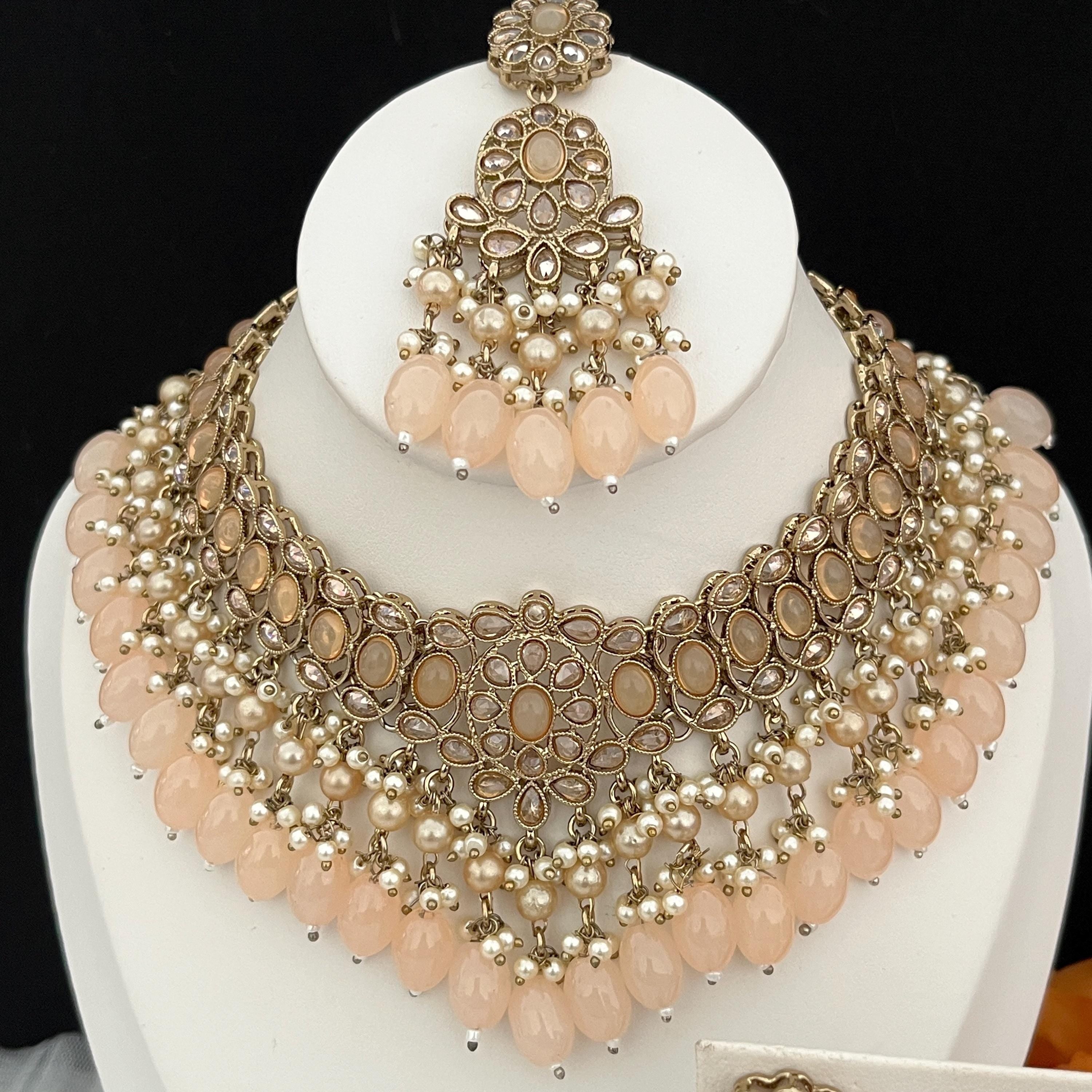 Indian Jewellery set with tikka, earrings and necklace Light peach in colouir