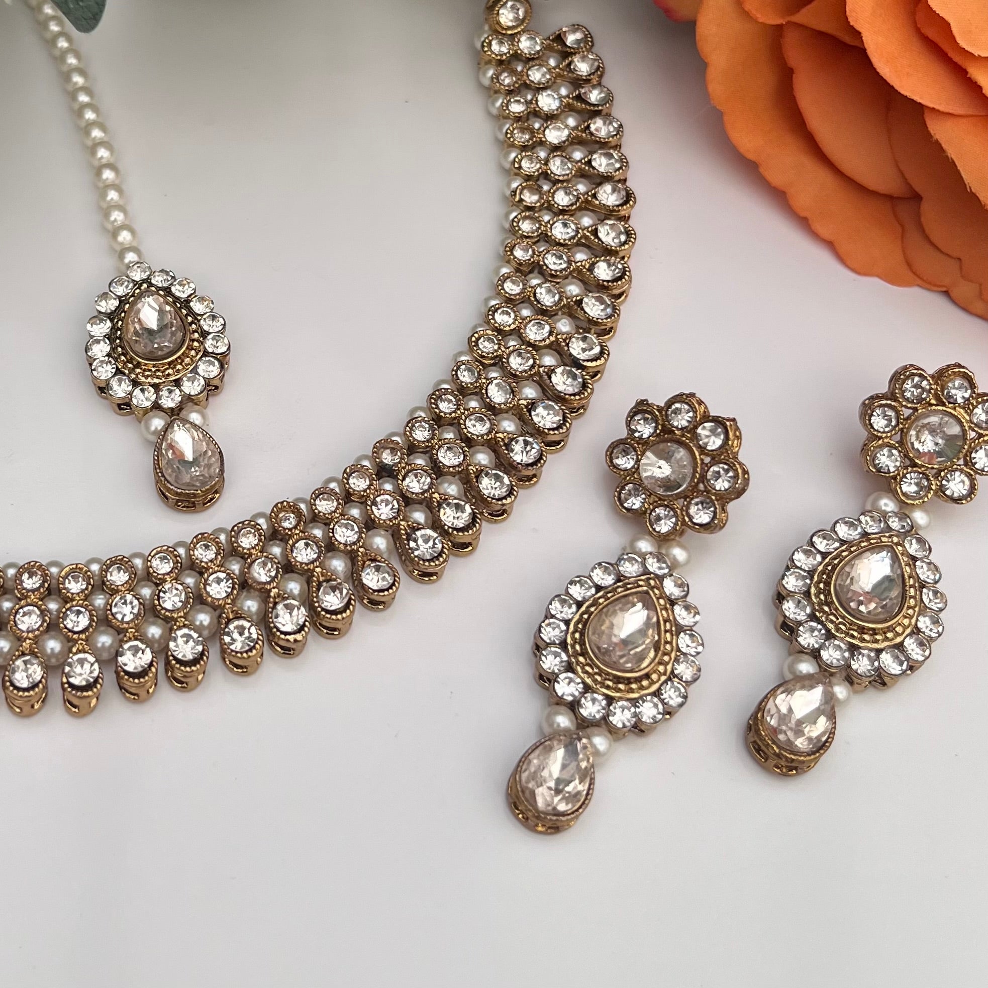 Reverse AD Gold and Transparent Stone coloured Jewellery