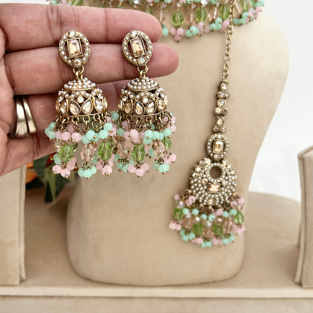 Pastel coloured crystal stones and Polki stones,necklace with tikka and earrings.