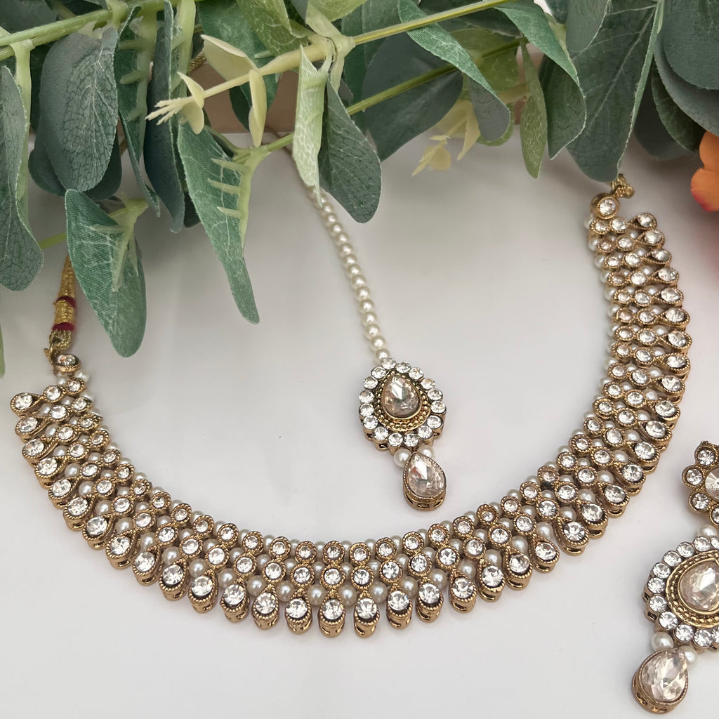 Reverse AD Gold and Transparent Stone coloured Jewellery