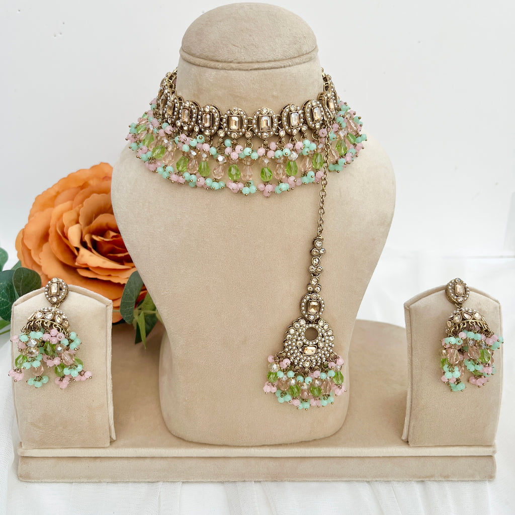 Pastel coloured crystal stones and Polki stones,necklace with tikka and earrings.