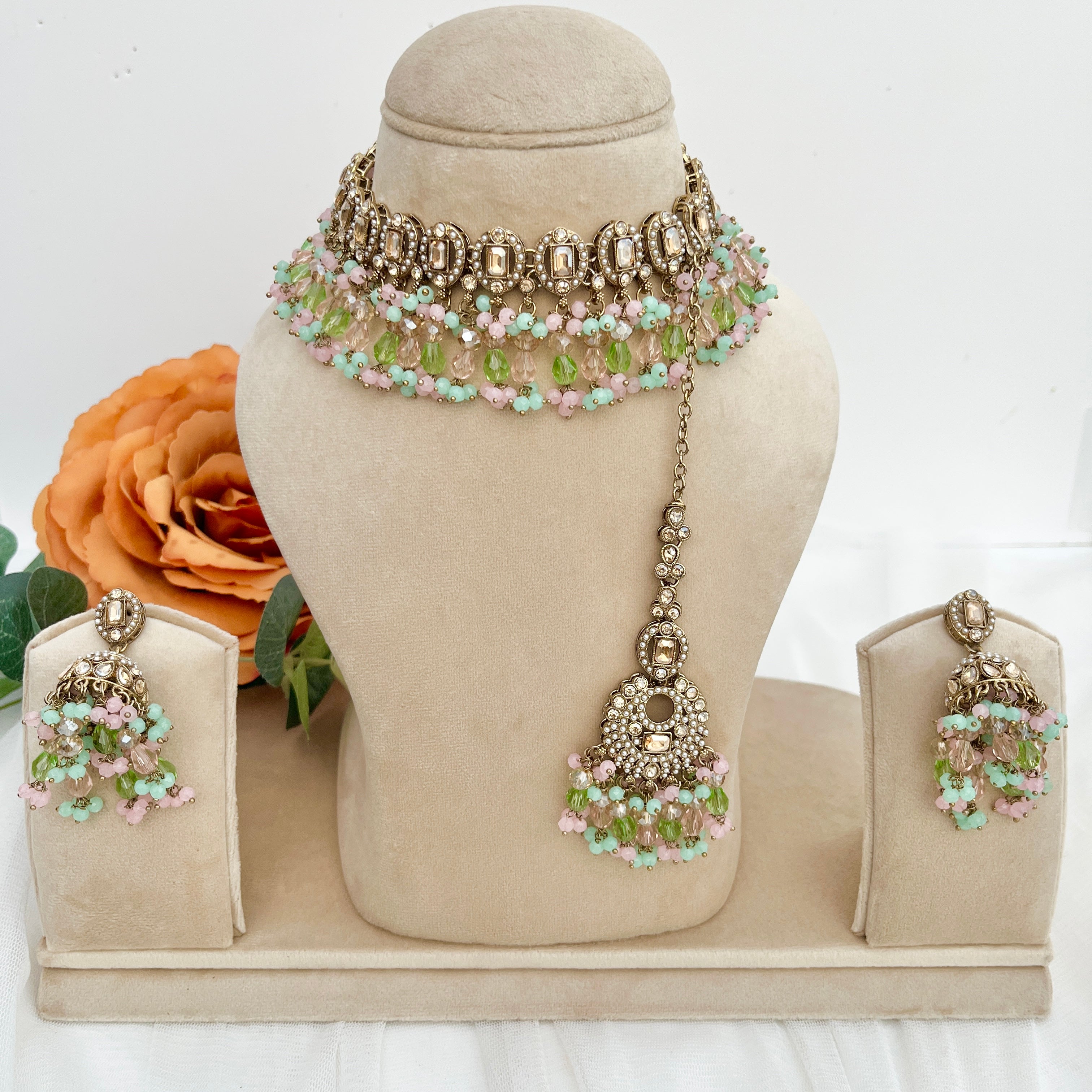 Pastel coloured crystal stones and Polki stones,necklace with tikka and earrings.