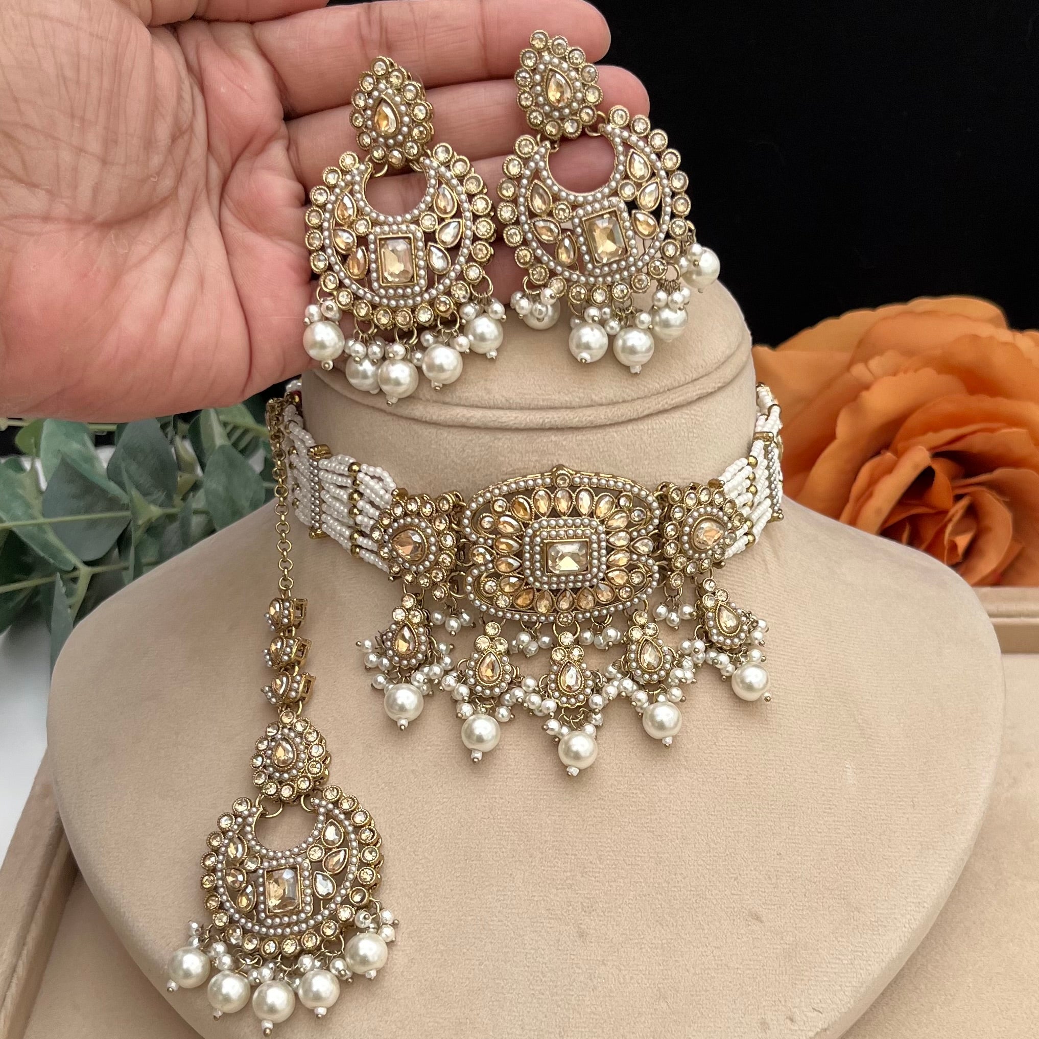 Elegant antique gold with brown Polki stones Choker with white pearls.