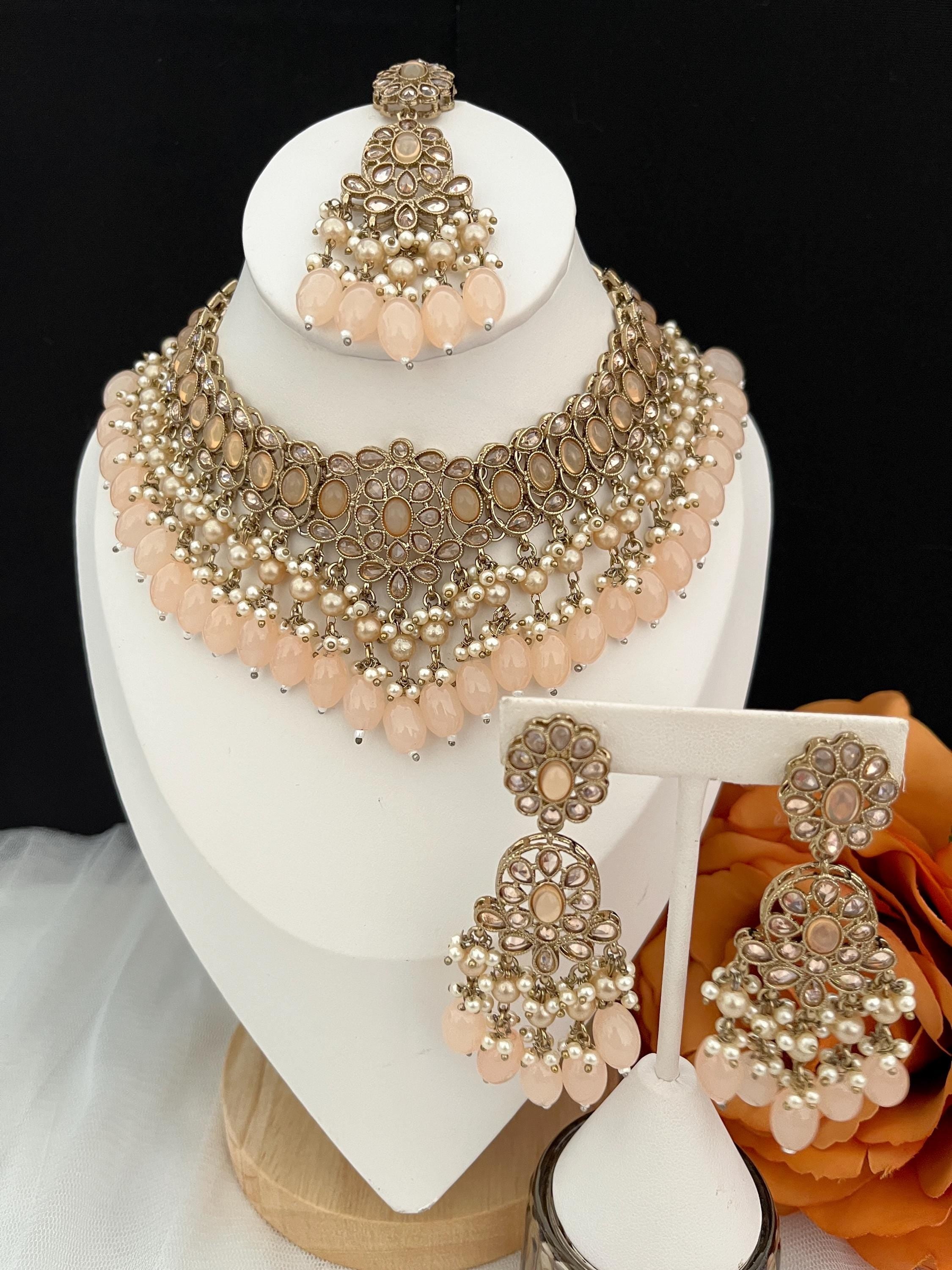 Indian Jewellery set with tikka, earrings and necklace Light peach in colouir