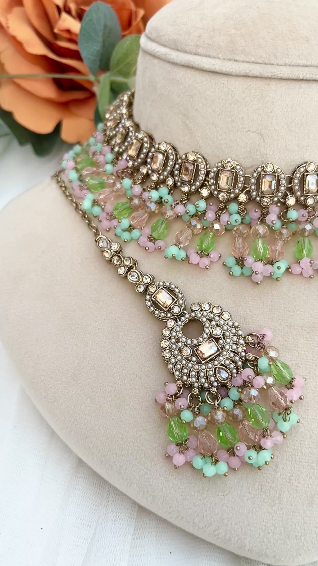 Pastel coloured crystal stones and Polki stones,necklace with tikka and earrings.