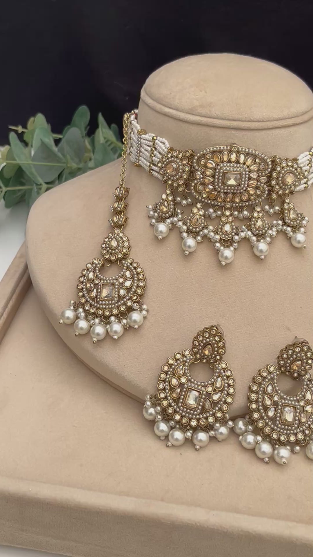 Elegant antique gold with brown Polki stones Choker with white pearls.